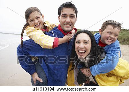 Picture - Happy family on beach. Fotosearch
