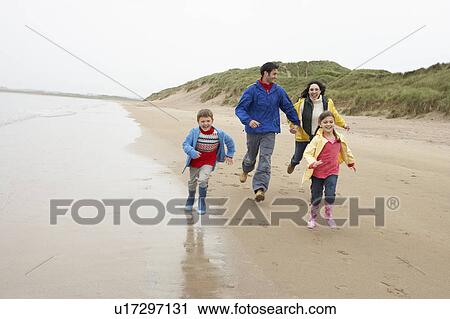 Happy family on beach View Large Photo Image Stock Image - Happy family on beach. Fotosearch