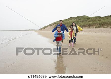 Happy family on beach View Large Photo Image Stock Photo - Happy family on beach. Fotosearch