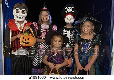 Picture - Happy Halloween party with children trick or treating. Fotosearch