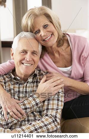 Happy Senior Couple Relaxing At Home View Large Photo Image Stock Image - Happy Senior Couple Relaxing At Home. Fotosearch