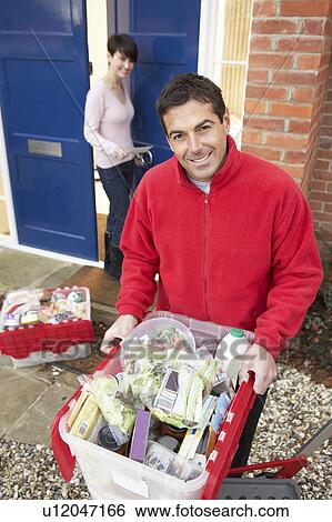 Home Delivery Grocery Driver Unloading Customer's Shopping View Large Photo Image Stock Photograph - Home Delivery Grocery Driver Unloading Customer's Shopping. Fotosearch