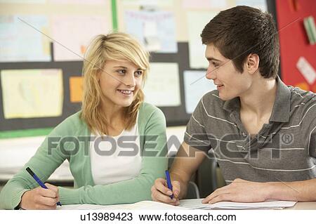 Male And Female Teenage Students Studying In Classroom View Large Photo Image Stock Image - Male And Female Teenage Students Studying In Classroom. Fotosearch