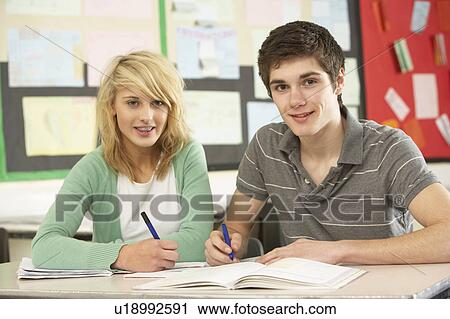 Male And Female Teenage Students Studying In Classroom View Large Photo Image Stock Image - Male And Female Teenage Students Studying In Classroom. Fotosearch