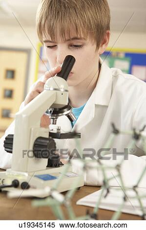 Male Teenage Student In Science Class Looking Through Microscope View Large Photo Image Stock Photography - Male Teenage Student In Science Class Looking Through Microscope. Fotosearch