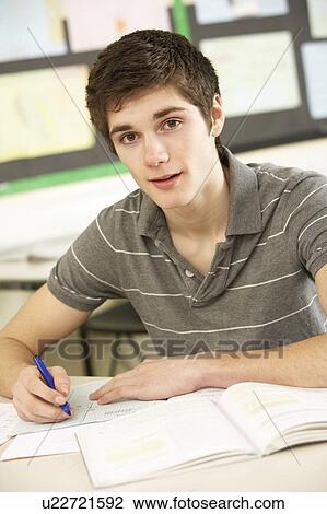 Male Teenage Student Studying In Classroom View Large Photo Image Stock Image - Male Teenage Student Studying In Classroom. Fotosearch