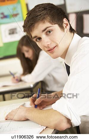 Male Teenage Student Studying In Classroom View Large Photo Image Stock Photograph - Male Teenage Student Studying In Classroom. Fotosearch