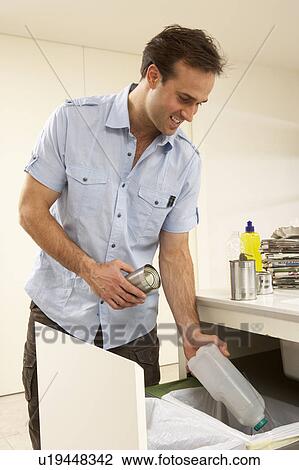 Man Recyling Waste At Home View Large Photo Image Stock Image - Man Recyling Waste At Home. Fotosearch