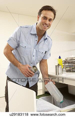Man Recyling Waste At Home View Large Photo Image Stock Photo - Man Recyling Waste At Home. Fotosearch