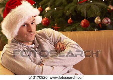 Man Relaxing In Front Of Christmas Tree View Large Photo Image Stock Image - Man Relaxing In Front Of Christmas Tree. Fotosearch