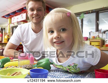 Man with children playing together View Large Photo Image Picture - Man with children playing together. Fotosearch