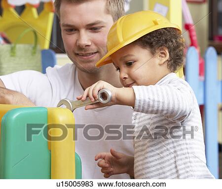Man with children playing together View Large Photo Image Stock Image - Man with children playing together. Fotosearch