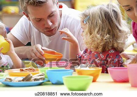 Man with children playing together View Large Photo Image Stock Image - Man with children playing together. Fotosearch