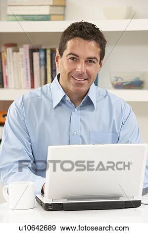 Man Working From Home Using Laptop View Large Photo Image Stock Photo - Man Working From Home Using Laptop. Fotosearch