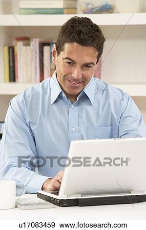 Man Working From Home Using Laptop View Large Photo Image Stock Photo - Man Working From Home Using Laptop. Fotosearch