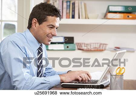 Man Working From Home Using Laptop View Large Photo Image Stock Photo - Man Working From Home Using Laptop. Fotosearch