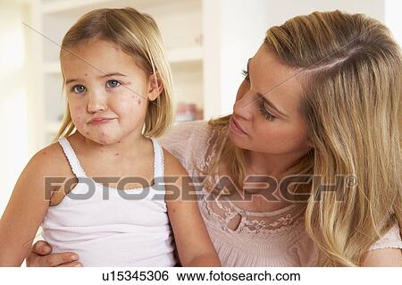 Mother nursing sick child View Large Photo Image Stock Photograph - Mother nursing sick child. Fotosearch