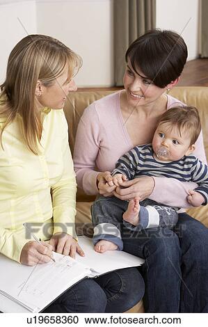 Mother With Baby Talking With Health Visitor At Home View Large Photo Image Stock Image - Mother With Baby Talking With Health Visitor At Home. Fotosearch
