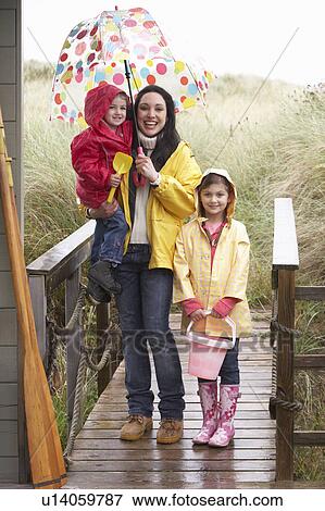 Stock Photo - Mother with children on beach. Fotosearch
