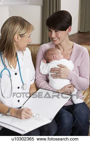 Mother With Newborn Baby Talking With Health Visitor At Home View Large Photo Image Stock Photography - Mother With Newborn Baby Talking With Health Visitor At Home. Fotosearch