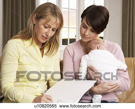 Stock Photography - Mother With Newborn Baby Talking With Health Visitor At Home. Fotosearch