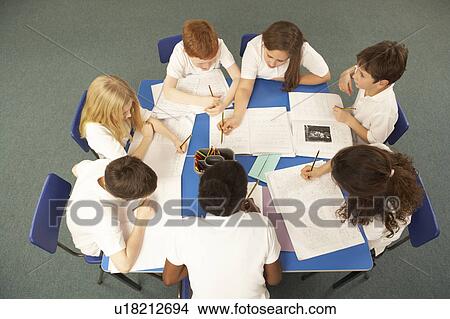 Overhead View Of Schoolchildren Working Together At Desk View Large Photo Image Picture - Overhead View Of Schoolchildren Working Together At Desk. Fotosearch