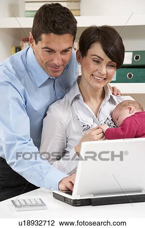 Parents With Newborn Baby Working From Home Using Laptop View Large Photo Image Stock Image - Parents With Newborn Baby Working From Home Using Laptop. Fotosearch