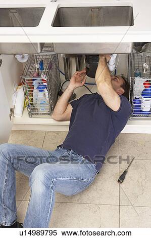 Plumber Working On Sink In Kitchen View Large Photo Image Stock Photography - Plumber Working On Sink In Kitchen. Fotosearch