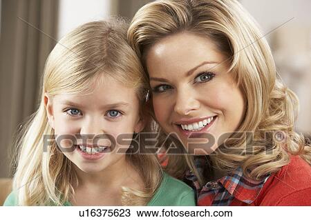 Stock Image - Portrait Of Happy Daughter With Mother. Fotosearch