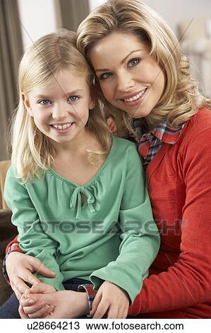 Stock Image - Portrait Of Happy Daughter With Mother. Fotosearch
