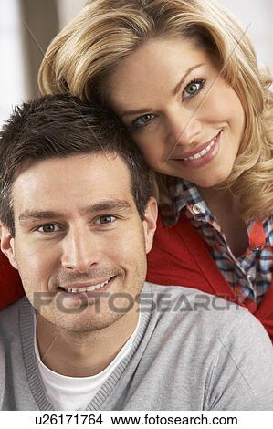 Portrait Of Happy Young Couple At Home View Large Photo Image Picture - Portrait Of Happy Young Couple At Home. Fotosearch