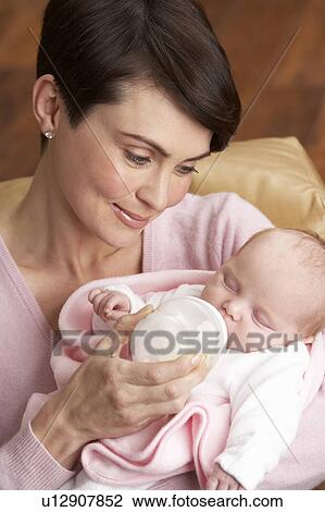 Portrait Of Mother Feeding Newborn Baby At Home View Large Photo Image Stock Image - Portrait Of Mother Feeding Newborn Baby At Home. Fotosearch