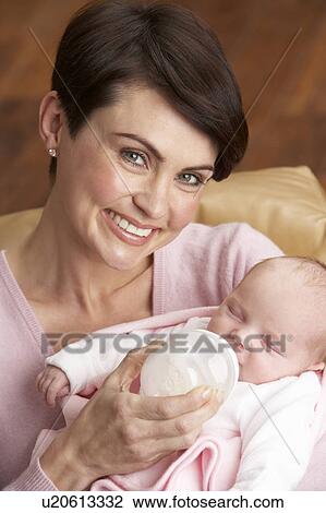 Portrait Of Mother Feeding Newborn Baby At Home View Large Photo Image Stock Image - Portrait Of Mother Feeding Newborn Baby At Home. Fotosearch