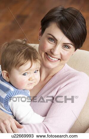 Portrait Of Mother With Baby At Home View Large Photo Image Stock Image - Portrait Of Mother With Baby At Home. Fotosearch