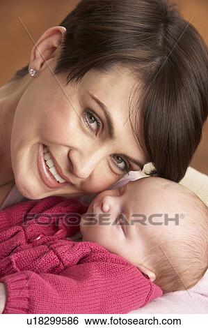 Portrait Of Mother With Newborn Baby At Home View Large Photo Image Stock Photograph - Portrait Of Mother With Newborn Baby At Home. Fotosearch