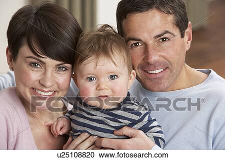 Portrait Of Proud Parents With Baby Son At Home View Large Photo Image Stock Image - Portrait Of Proud Parents With Baby Son At Home. Fotosearch