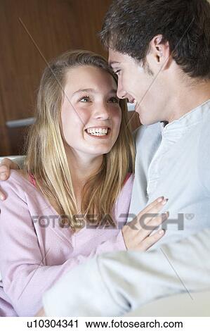Romantic Teenage Couple Sitting On Sofa At Home Together View Large Photo Image Stock Image - Romantic Teenage Couple Sitting On Sofa At Home Together. Fotosearch