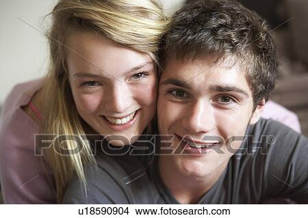 Picture - Romantic Teenage Couple Smiling At Camera. Fotosearch