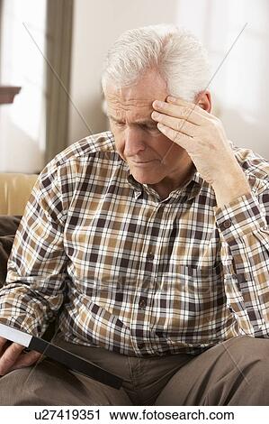 Sad Senior Man Looking At Photograph In Frame View Large Photo Image Stock Image - Sad Senior Man Looking At Photograph In Frame. Fotosearch