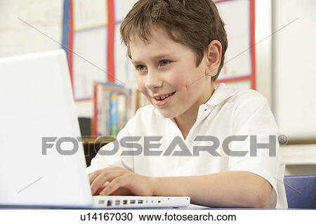 Schoolboy In IT Class Using Computer View Large Photo Image Stock Image - Schoolboy In IT Class Using Computer. Fotosearch