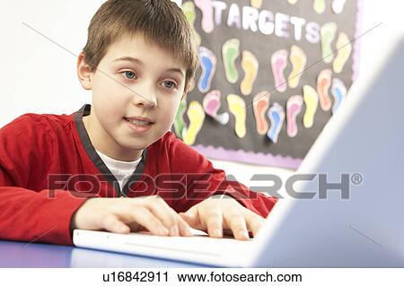 Schoolboy In IT Class Using Computer View Large Photo Image Stock Image - Schoolboy In IT Class Using Computer. Fotosearch