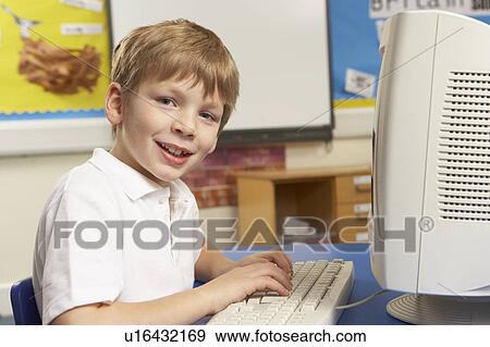 Schoolboy In IT Class Using Computer View Large Photo Image Stock Photo - Schoolboy In IT Class Using Computer. Fotosearch