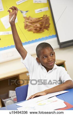 Schoolboy Raising Hand In Classroom View Large Photo Image Stock Photograph - Schoolboy Raising Hand In Classroom. Fotosearch
