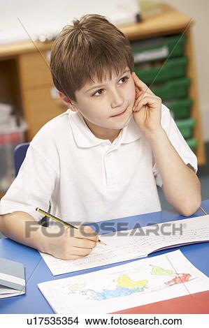 Schoolboy Studying In Classroom View Large Photo Image Picture - Schoolboy Studying In Classroom. Fotosearch