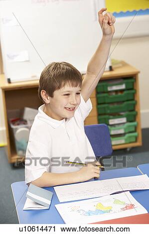Stock Image - Schoolboy Studying In Classroom. Fotosearch