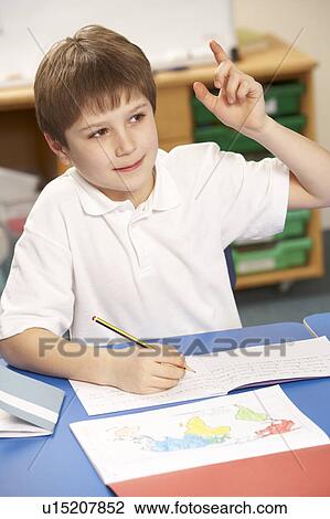 Schoolboy Studying In Classroom View Large Photo Image Stock Image - Schoolboy Studying In Classroom. Fotosearch