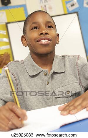 Schoolboy Studying In Classroom View Large Photo Image Stock Image - Schoolboy Studying In Classroom. Fotosearch