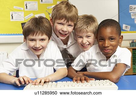 Schoolchildren in IT Class Using Computers View Large Photo Image Stock Image - Schoolchildren in IT Class Using Computers. Fotosearch
