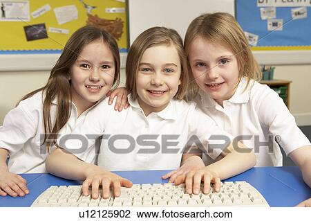 Stock Image - Schoolchildren in IT Class Using Computers. Fotosearch