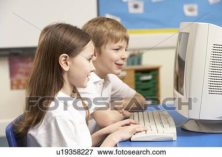 Schoolchildren In IT Class Using Computer View Large Photo Image Stock Photo - Schoolchildren In IT Class Using Computer. Fotosearch